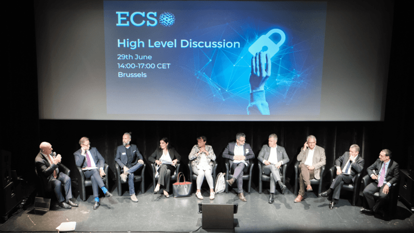 An image of panellists sitting on stage and talking.
